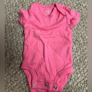 Caters pink newborn onesie